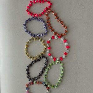 Set of 8 multicolored elephant bracelets with trunk up